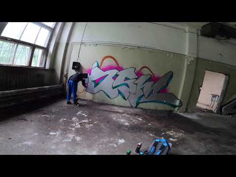 Graffiti bombing on an abandoned place with a crew boy. Experimenting and practice with tags