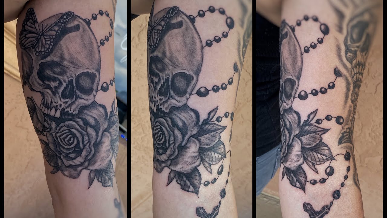 Skull Rose Butterfly and Rosary Bicep Tattoo