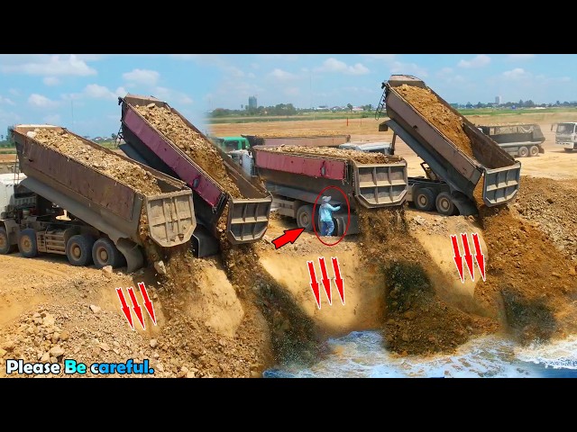 Great Action Landfilling Operation Heavy Dump Truck Unloading Stone Soil, Dozer KOMATSU D58P Pushing SDDEFAULT Thumbnail