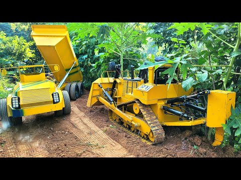 dozer and dump truck | caterpillar d11, volvo a30g