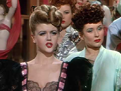 Trailer still of Judy Garland arriving by train in The Harvey Girls, foreshadowing the locomotive showpiece 'On the Atchison, Topeka and the Santa Fe'
