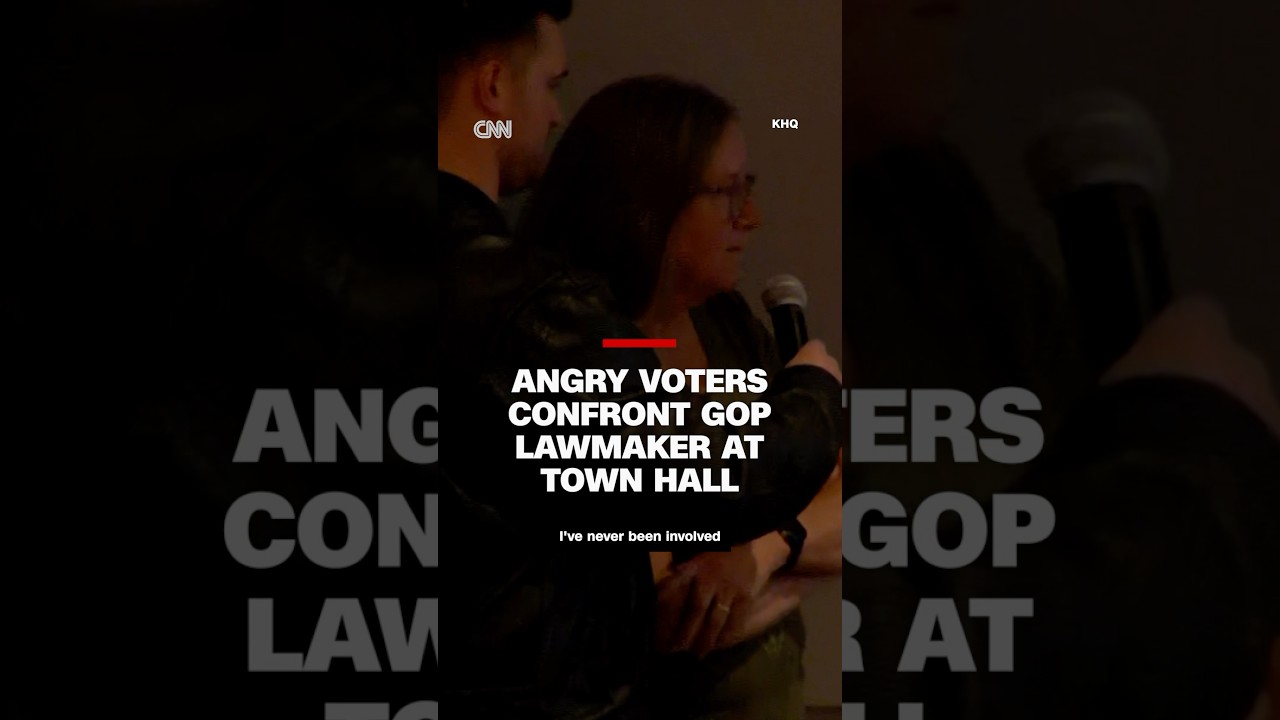 Voters confront GOP lawmaker over Trump's moves at tense town hall