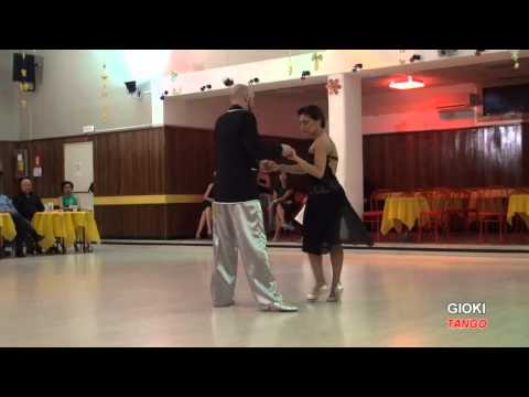  Giovanna Di Fazi  and  Andrea Degani  are  dancing  to  the  milonga  "  El apache argentino  "  at  Salonissimo Savona Tango Festival  in  2015