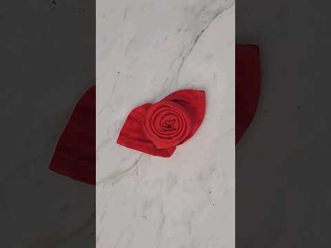 Fold a napkin into a rose for Valentine's Day #napkinfolding #valentineday #tablesetting