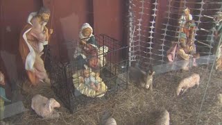 Baby Jesus in cage in church’s immigration-themed nativity scene