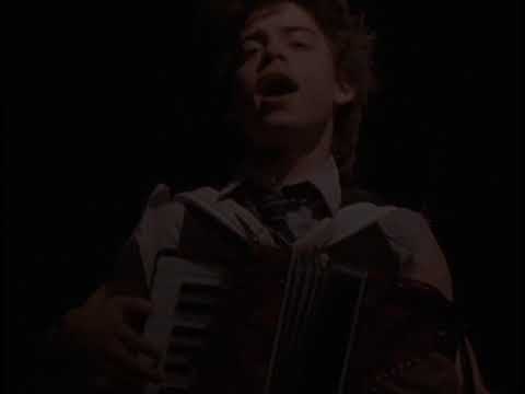 Trailer image: singer at a mic, hand on heart, crowd visible in soft focus