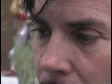 Trailer frame: road atlas on a van dashboard, music spilling into travel and talk