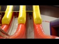 The Kids Going Down A Big Slide At BounceU
