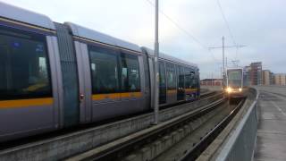 preview picture of video 'two luas pass one another on the red line by red cow'