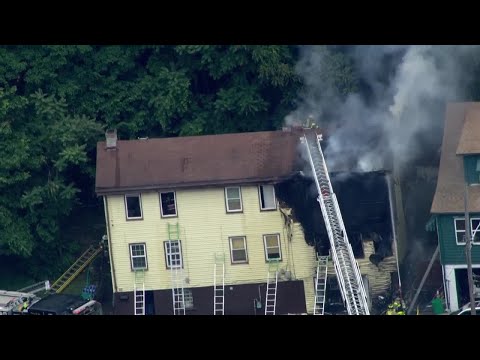 Raw video: Front of building charred as crews battle fire in Etna