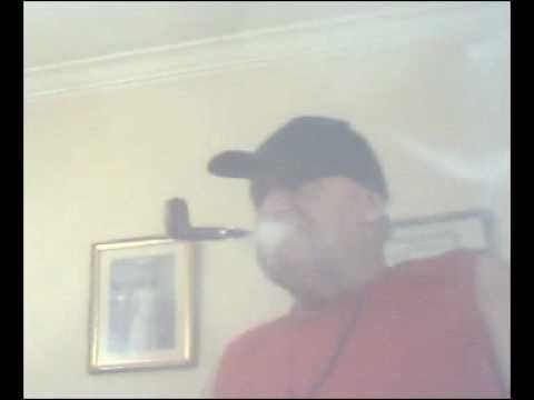 Smoker, of Chacom Bayard Pipe Tobaccos, with Black Hat; Red T-Shirt.