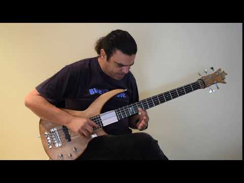 'snare drum' percussive slap sound on bass by Kostas Domenikiotis.