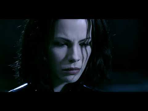 Trailer action montage — blue-lit corridors, muzzle flashes, and Selene’s dive cut to industrial downbeats