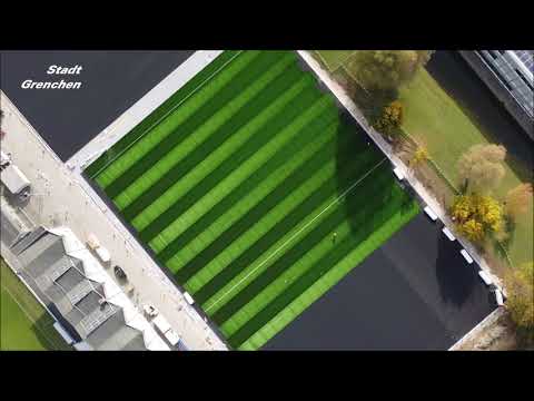 Bau von Kunstrasen und Leichtathletikstadion