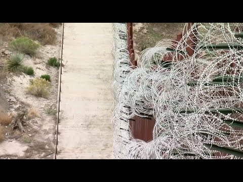 Officials in the small Arizona border city of Nogales are decrying the installation of new razor wire that now covers the entirety of a tall border wall through downtown. (Feb. 6)