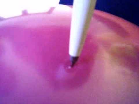 poping balloon with pen.. real close