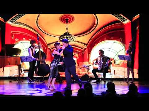  Anna Sokhnenko  and  Sergey Sokhnenko  are  dancing  to  a  tango  at  White Nights tango festival  in  2018