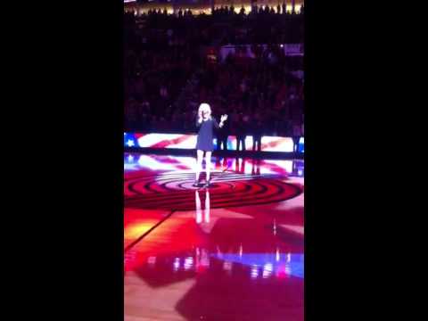 Britnee Kellogg singing the National Anthem at the Portland