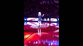 Britnee Kellogg singing the National Anthem at the Portland