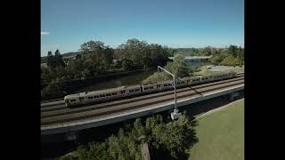 QR EMU 59 on the Farewell Tour crosses over North Pine River working on run J5K2 CAIP service 05~07