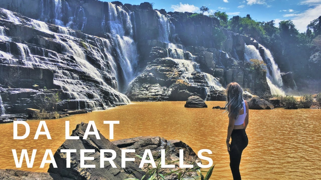 Experience the raw intensity of Dalat's potent Elephant Falls, dramatically captured in a cinematic view with cascading water and mist-filled ambiance.