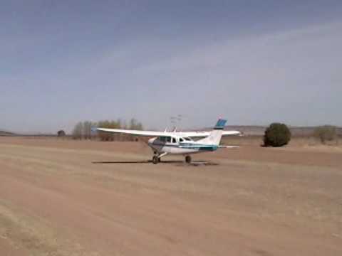 Cessna 206 landing and  fast climb take off