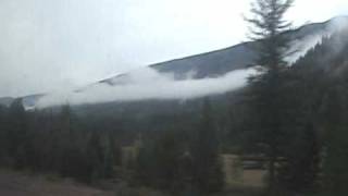 preview picture of video 'Empire Builder eastbound - Cloud Shrouded Mts east of Essex 2009-09-06'