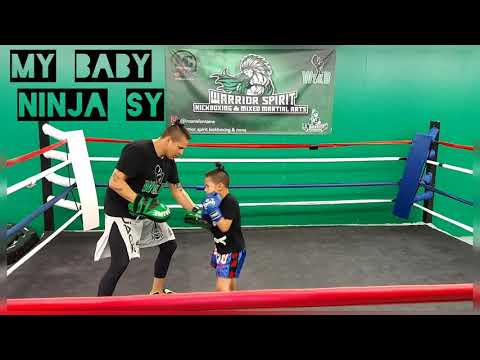 Father and Son time in the Boxing Ring. Kickboxing pad work.