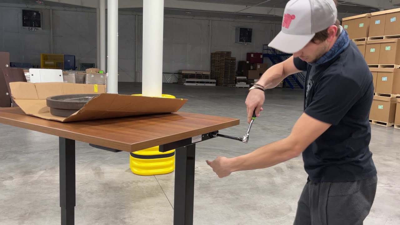 Are you thinking about a pneumatic desk Watch this first.