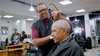 President Obama drops by his old barbershop for a haircut