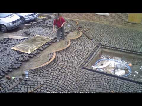 Laying reclaimed granite blocks for driveway