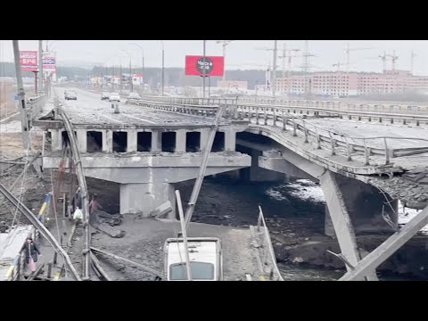 Ukrainians Cross Destroyed Bridge to Evacuate