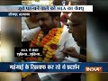 Ahemdabad Congress MLA garlanded with shoes during a rally