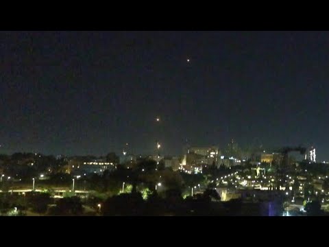 Iranian missiles and Israeli air defense systems light up the sky over Jerusalem | AFP