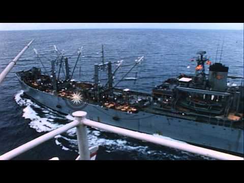 USS Pollux (AKS-4) and USS Constellation (CVA-64) underway in Gulf of Tonkin, Vie...HD Stock Footage