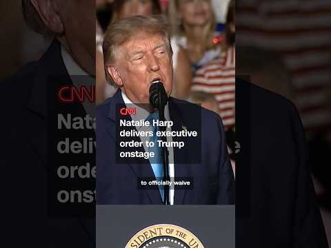 Natalie Harp delivers executive order to Trump onstage