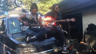 Adam Baldwin and Matt Mays play "Learning To Fly" on the hood of a van in a Toronto alley.