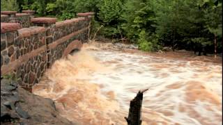 preview picture of video 'Amity Creek, Lester Park: Raging Rapids Pummel 2nd Bridge, Duluth Flood 2012 V1456E'