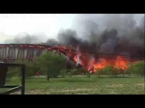 Burning Texas railroad bridge collapses