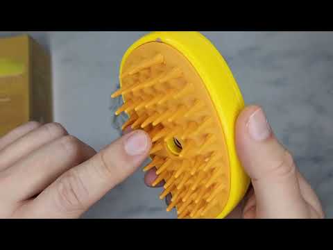 Part of a video titled Cat Steam Brush, Cat Hair Brush with Steamer, New 3 In1 Steamy Pet Cat ...