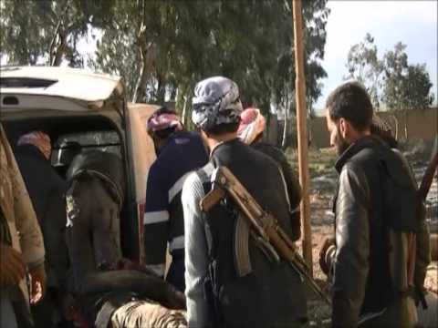 عناصر كتيبة صقور السنة ولواء جعفر الطيار في معركة السيطرة على حاجز الكبر في الريف الغربي لمحافظة دير الزور