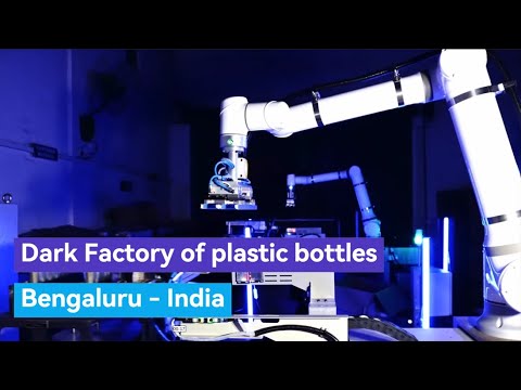 Elite Robots EC612 pick & case at dark factory, India