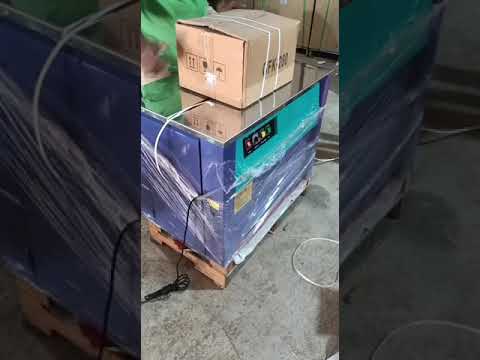 Carton strapping machine, 1.6 sec/strap