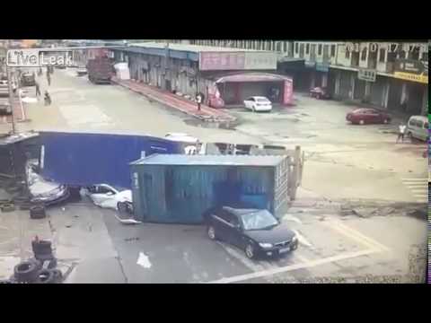 Two cars gets crushed by speeding truck loaded with shipping containers