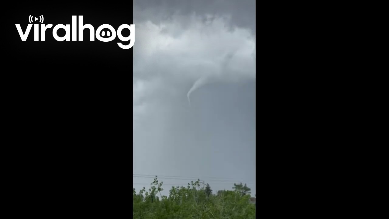 Funnel Cloud Spins Near Colorado Neighborhood During Severe Storm || ViralHog