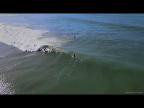 Aerial view of surfers and waves at Woolacombe