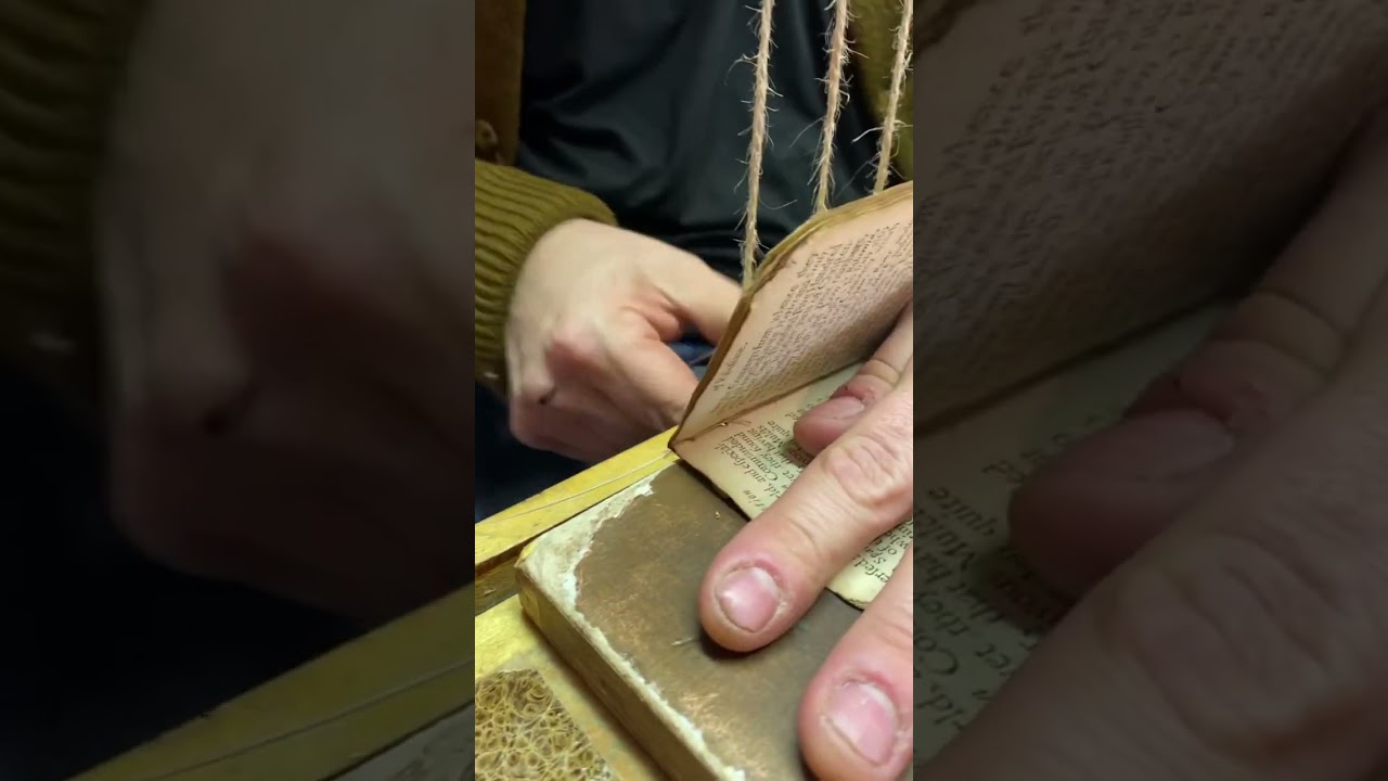 Bookbinder sews a rare book. #bookbinding #bookrepair #oldbooks #rarebooks #bookrestoration
