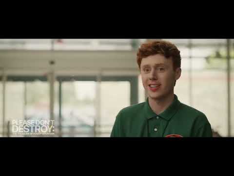 Trailer frame with the trio mid-celebration as a pop-rap hook slams in