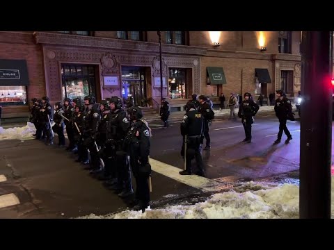 Police in riot gear at downtown Minneapolis ICE protest