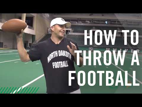 Part of a video titled How to Throw the Perfect Spiral Football - YouTube